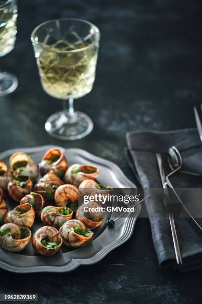 french escargot snails with herb butter - herb butter stock pictures, royalty-free photos & images
