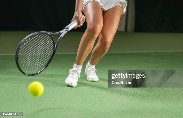 female tennis player legs medium shot - bouncing tennis ball stock pictures, royalty-free photos & images