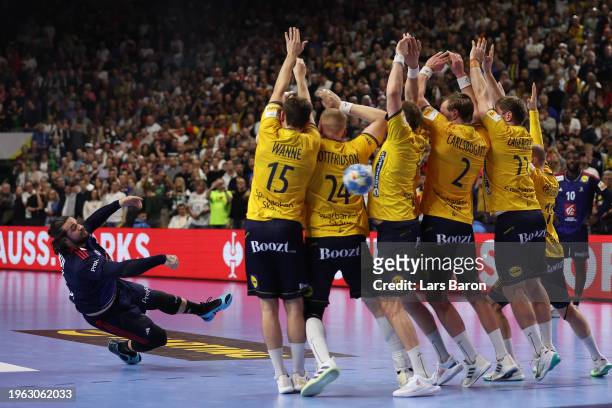 Elohim Prandi of France scores a last minute goal during the Men's EHF Euro 2024 first semi-final match between France and Sweden at Lanxess Arena on...