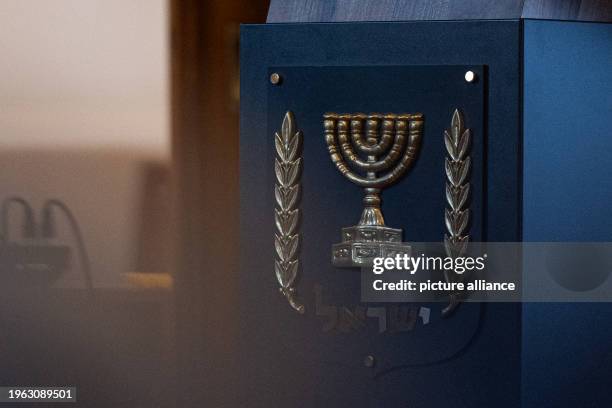 January 2024, Berlin: A menorah is depicted on a relief picture attached to the lectern at the Israeli embassy in Berlin. An event was held here to...