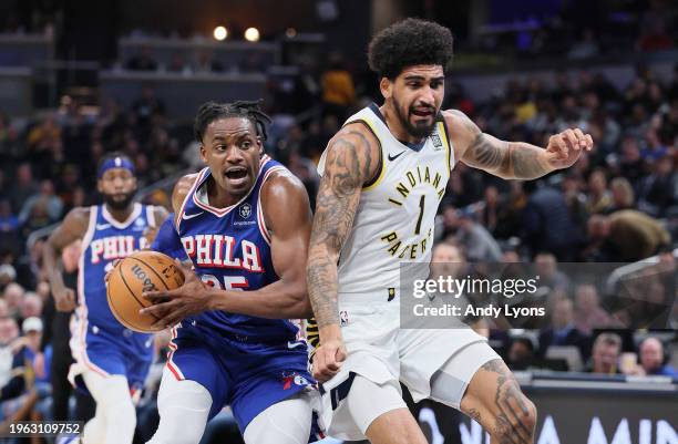 Danuel House Jr of the Philadelphia 76ers dribbles the ball in the first half while defended by Obi Toppin the Indiana Pacers at Gainbridge...