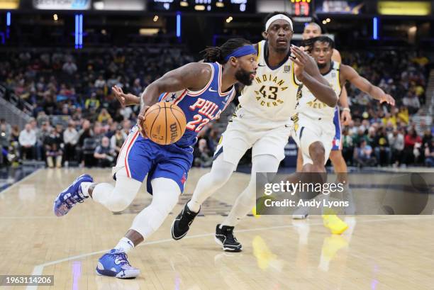 Patrick Beverley of the Philadelphia 76ers dribbles the ball in the first half while defended by Pascal Siakam of the Indiana Pacers at Gainbridge...