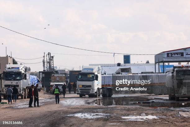 Limited number of United Nations trucks carrying humanitarian aid for Palestinians cross Kerem Shalom border crossing after waiting for 5 days for...