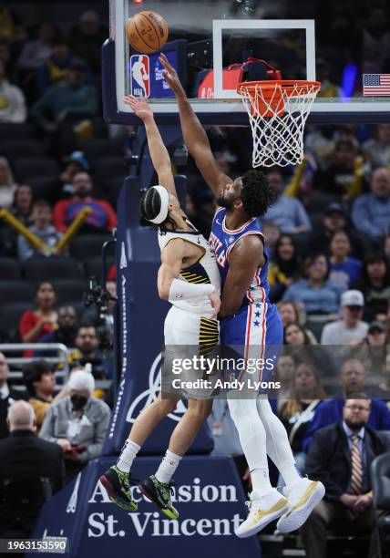 Joel Embiid of the Philadelphia 76ers defends the shot of Andrew Nembhard of the Indiana Pacers at Gainbridge Fieldhouse on January 25, 2024 in...