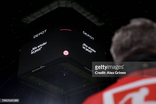 An LED board inside the stadium reads "Nie wieder ist jetzt! - Never Again is Now" prior to the Bundesliga match between Eintracht Frankfurt and 1....
