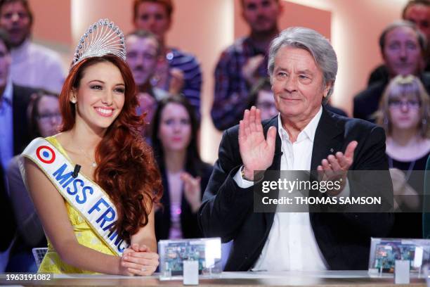 Newly crowned Miss France 2012, Delphine Wespiser and French actor, honorary president of the Miss France beauty contest Alain Delon take part in the...