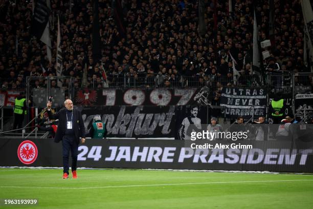 Peter Fischer, President of Eintracht Frankfurt acknowledges fans during a farewell ceremony prior to the Bundesliga match between Eintracht...