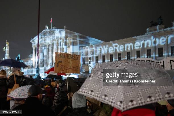 People gather in front of the Austrian Parliament to protest against right-wing extremism as similar demonstrations are taking place elsewhere across...