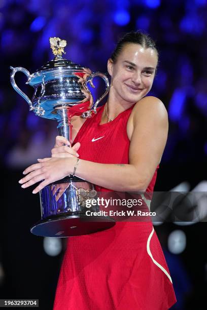 Australian Open: Aryna Sabalenka of Belarus in action, poses with the Daphne Akhurst Memorial Cup following victory vs Qinwen Zheng of China during a...