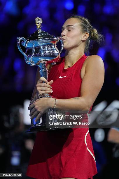 Australian Open: Aryna Sabalenka of Belarus in action, kisses the Daphne Akhurst Memorial Cup following victory vs Qinwen Zheng of China during a...