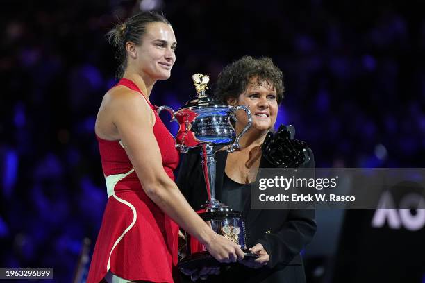 Australian Open: Aryna Sabalenka of Belarus in action, poses Evonne Goolagong Cawley and the Daphne Akhurst Memorial Cup following victory vs Qinwen...