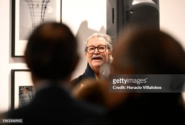 Portuguese photojournalist Eduardo Gageiro gestures while delivering remarks on inuguration day of "Factum", his exhibition of photographs from 1974...