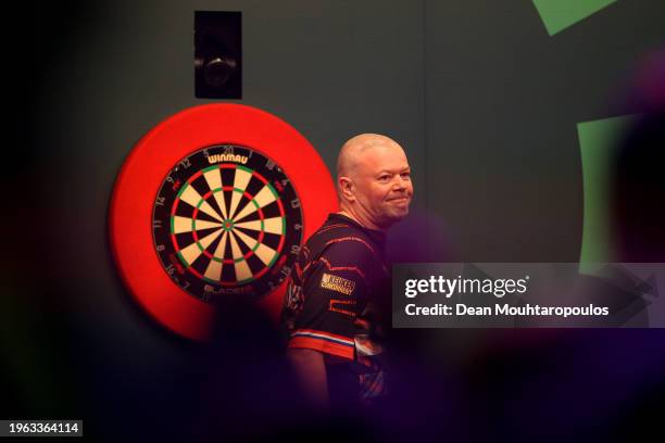 Raymond van Barneveld of Netherlands reacts against Rob Cross of England during their Round 1 match in the 2024 TOTO Dutch Darts Masters at Maaspoort...