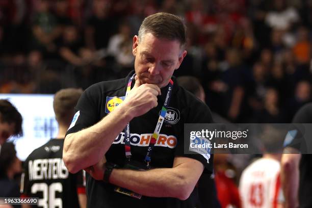 Alfred Gislason, head coach of Germany looks dejected during the Men's EHF Euro 2024 second semi-final match between Germany and Denmark at Lanxess...