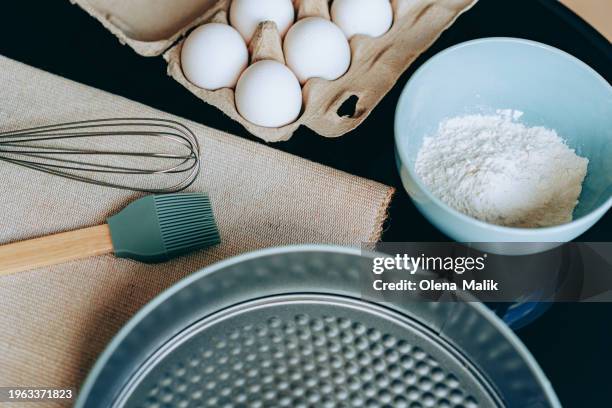 baking concept. flour and eggs on a dark background, copy space - close up bread roll black backdrop horizontal stock pictures, royalty-free photos & images