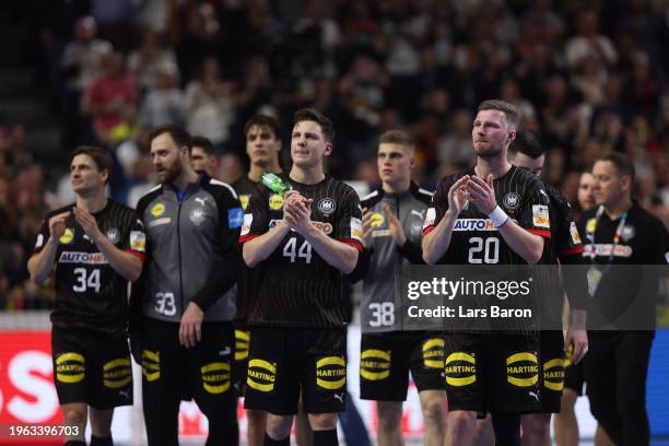 Players of Team Germany look dejected after loosing the Men's EHF Euro 2024 second semi-final match between Germany and Denmark at Lanxess Arena on...