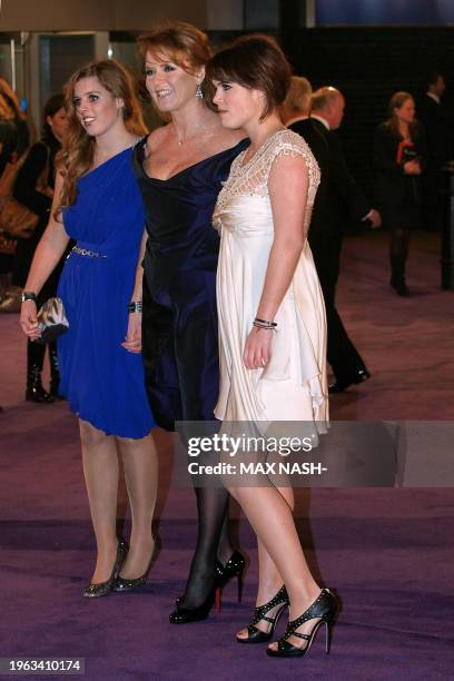 Britain's Duchess of York poses with her daughters Beatrice and Eugenie as they arrive for the world premiere of the film 'The Young Victoria' in...