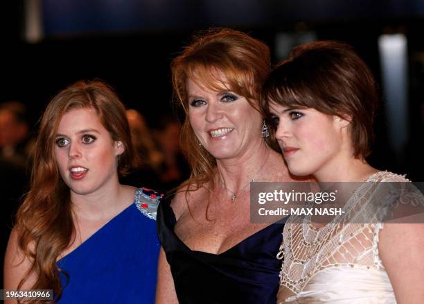 Britain's Duchess of York poses with her daughters Beatrice and Eugenie as they arrive for the world premiere of the film 'The Young Victoria' in...