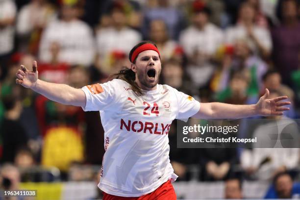 Mikkel Hansen celebrates after winning the Men's EHF Euro 2024 second semi-final match between Germany and Denmark at Lanxess Arena on January 26,...