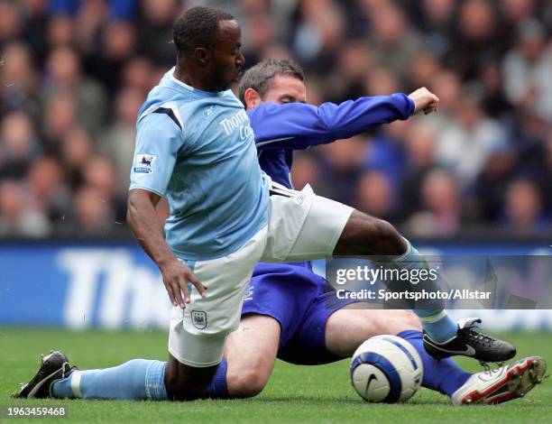 October 2: David Weir of Everton and Darius Vassell of Manchester City challenge during the Premier League match between Manchester City and Everton...