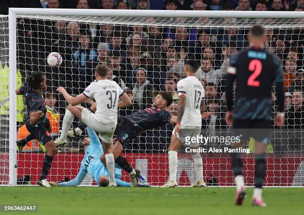 Nathan Ake of Manchester City scores their sides first goal during the Emirates FA Cup Fourth Round match between Tottenham Hotspur and Manchester...