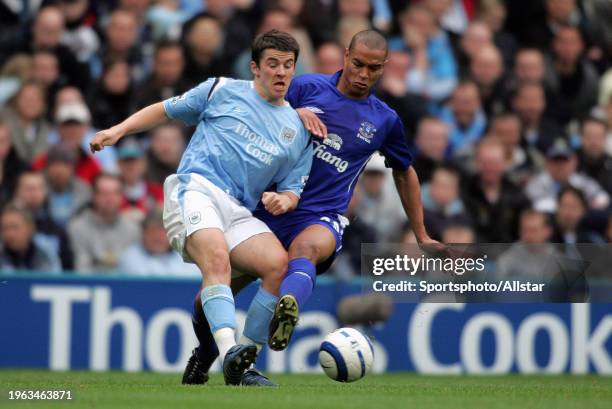 October 2: Joey Barton of Manchester City and Matteo Ferrari of Everton challenge during the Premier League match between Manchester City and Everton...