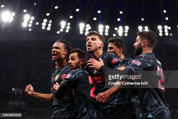 Nathan Ake of Manchester City celebrates with team mates Bernardo Silva, Ruben Dias, Rodri and Josko Gvardiol of Manchester City after scoring their...