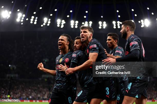 Nathan Ake of Manchester City celebrates with team mates Bernardo Silva, Ruben Dias, Rodri and Josko Gvardiol of Manchester City after scoring their...