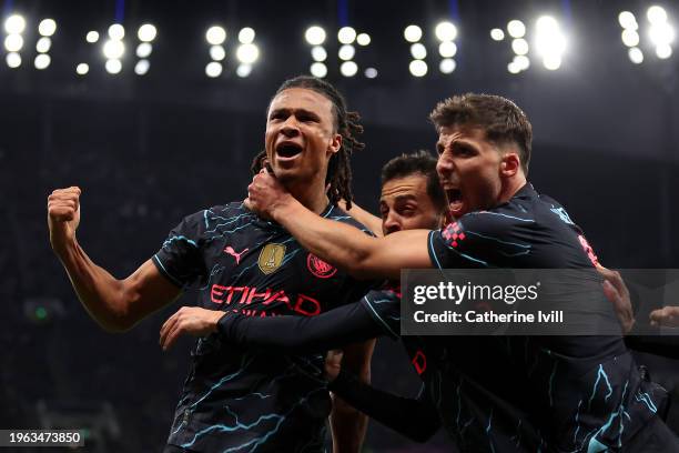 Nathan Ake of Manchester City celebrates with team mates Bernardo Silva and Ruben Dias after scoring their sides first goal during the Emirates FA...