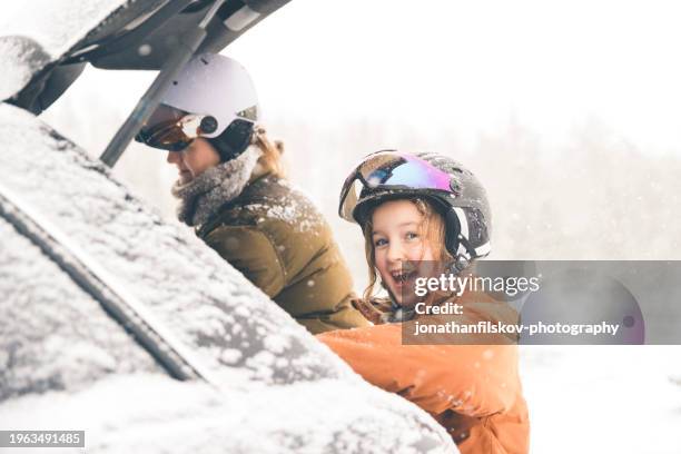 mother and daughter getting unpacking the car for skiing - family skiing stock pictures, royalty-free photos & images