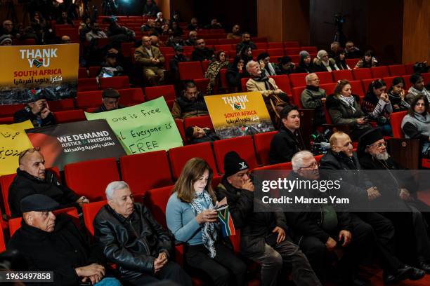 Small crowd gathers to watch the International Court of Justice announce their ruling in a case brought by South Africa that that accuses Israel of...