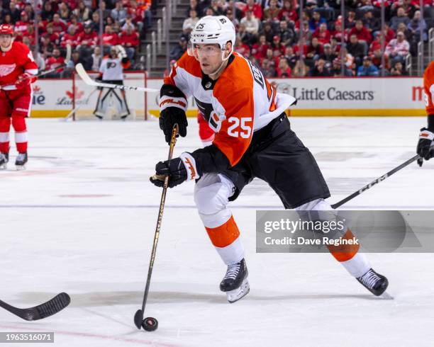 Ryan Poehling of the Philadelphia Flyers skates up ice with the puck against the Detroit Red Wings during the second period at Little Caesars Arena...