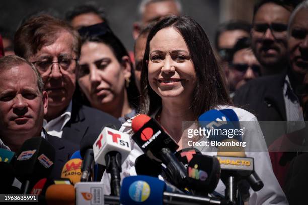 Maria Corina Machado, Venezuelan opposition's presidential candidate, center right, during a press conference in Caracas, Venezuela, on Monday, Jan....