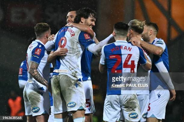 Blackburn Rovers' English striker Sam Gallagher celebrates with teammates after scoring the their second goal during the English FA Cup fourth round...