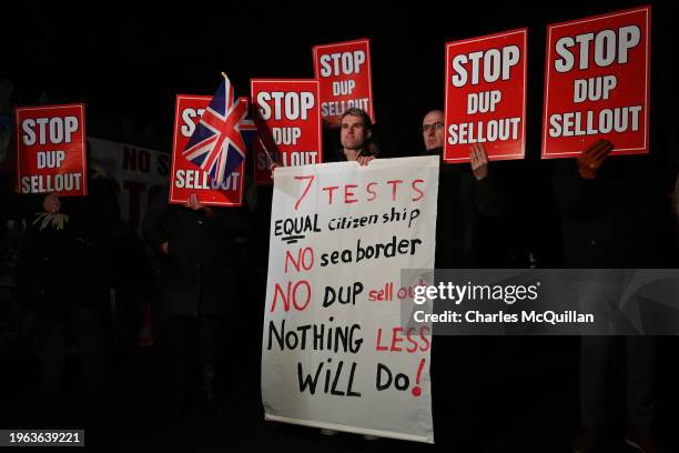 Unionist protestors demonstrate against a possible DUP decision to accept the government offer to go back into the Stormont assembly outside...