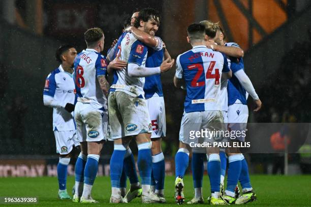 Blackburn Rovers' English striker Sam Gallagher celebrates with teammates after scoring the their second goal during the English FA Cup fourth round...