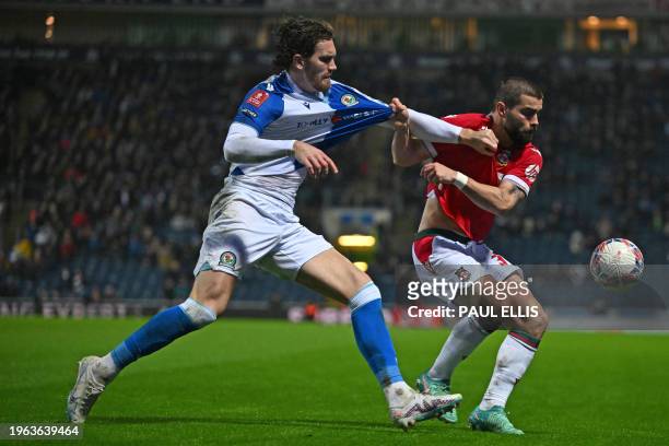 Blackburn Rovers' English striker Sam Gallagher vies with Wrexham's English midfielder Elliot Lee during the English FA Cup fourth round football...