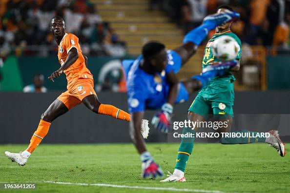 Ivory Fights Ivory Coast's forward Nicolas Pepe fights for the ball with Senegal's ...