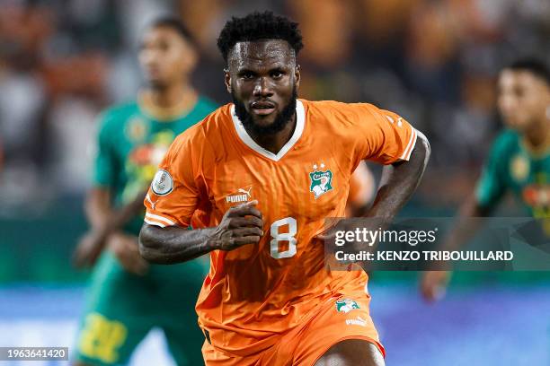 Ivory Coast's midfielder Franck Kessie celebrates after scoring his team's first goal from the penalty spot during the Africa Cup of Nations 2024...