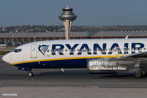 Passenger flight of Ryanair in a runway at Adolfo Suarez Madrid-Barajas Airport passing by the control tower. The President of the Government of...