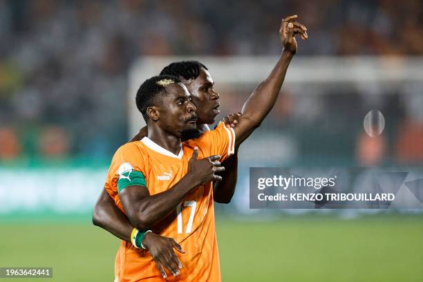 Ivory Coast's defender Serge Aurier celebrates after the victory at the end of the Africa Cup of Nations 2024 round of 16 football match between...