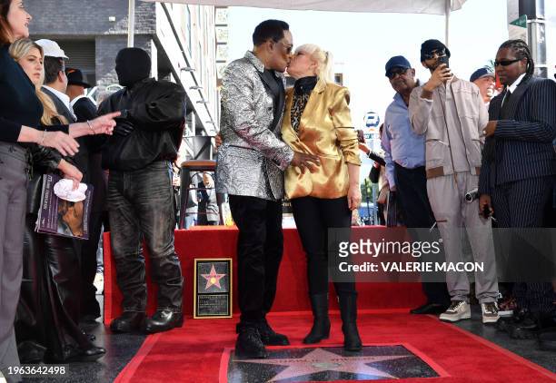 Singer/songwriter Charlie Wilson and wife Mahin Wilson pose during Wilson's Hollywood Walk of Fame star ceremony on January 29, 2024 in Los Angeles,...