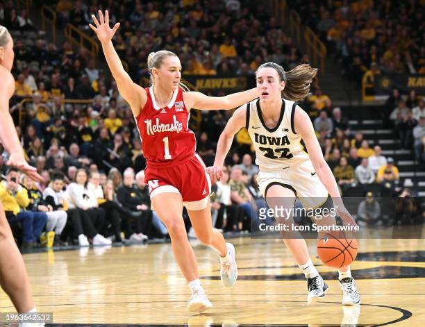 Iowa guard Caitlin Clark drives to the basket as Nebraska guard Jay Shelley defends during a women's college basketball game between the Nebraska...