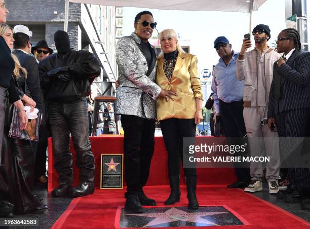 Singer/songwriter Charlie Wilson and wife Mahin Wilson pose during Wilson's Hollywood Walk of Fame star ceremony on January 29, 2024 in Los Angeles,...