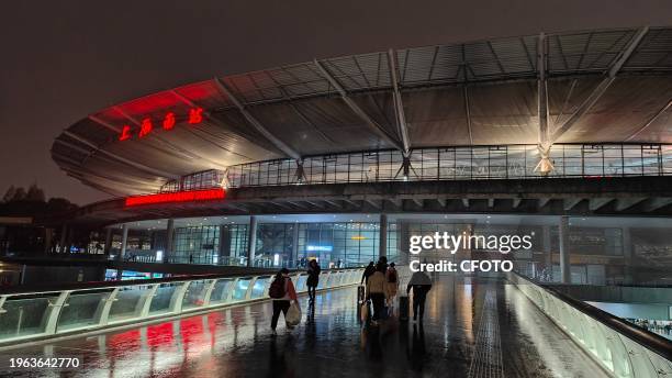 Tourists travel at night at Shanghai South Railway Station during the Spring Festival travel rush in Shanghai, China, Jan 29, 2024.