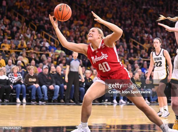Nebraska center Alexis Markowski tries to control a rebound during a women's college basketball game between the Nebraska Cornhusker and the Iowa...