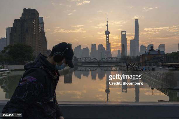 Buildings in Pudong's Lujiazui Financial District in Shanghai, China, on Monday, Jan. 29, 2024. China will halt the lending of certain shares for...