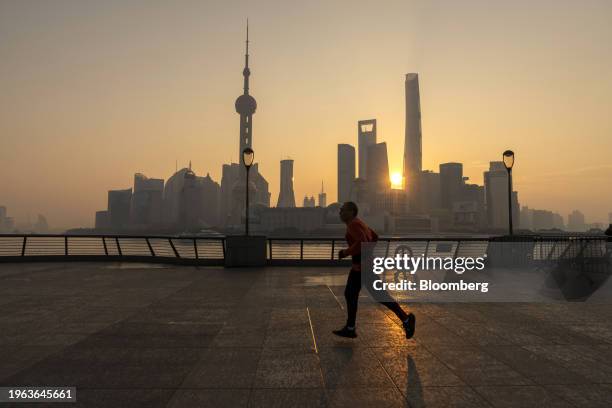 Buildings in Pudong's Lujiazui Financial District in Shanghai, China, on Monday, Jan. 29, 2024. China will halt the lending of certain shares for...