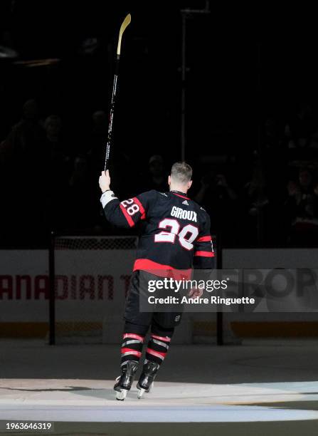 Claude Giroux of the Ottawa Senators salutes the crowd after being named first star of the game after scoring the overtime game winning goal against...