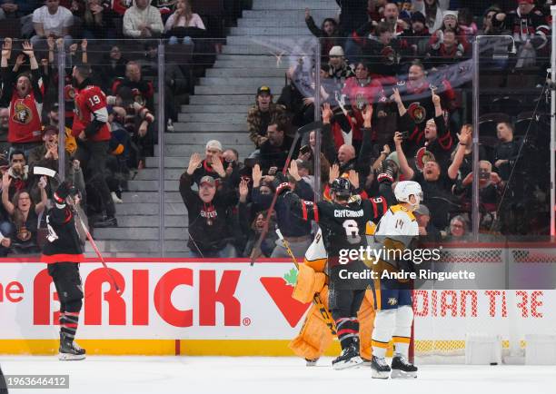 Claude Giroux of the Ottawa Senators celebrates his game winning overtime goal against the Nashville Predators with teammate Jakob Chychrun at...